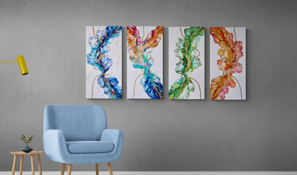 Four Season Celebration series paintings on a wall next to a chair. Abstract Art by Thanh Lyons