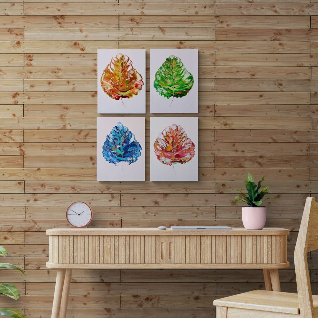 Four Season Leaf set hanging on a wall in front of a wooden desk. Abstract Art by Thanh Lyons