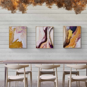 Three Tale of Golden Land Triptych (180 x 76 cm) paintings hanging above a wooden dining table. Abstract Art by Thanh Lyons