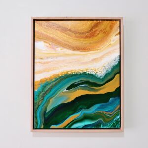 The Forest and Fields 4 (40 x 50 cm) abstract painting, featuring swirling green, gold, and white patterns, is framed in light wood and hangs on a plain white wall. Abstract Art by Thanh Lyons