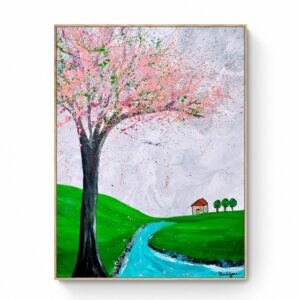 Spring is here," a stunning painting measuring 80 x 105 cm, showcases a landscape with a large tree adorned with pink blossoms, a winding blue river, green hills, and a small house with a red roof in the distance. This artwork captures the essence of Spring and is elegantly framed in a simple gold frame. Abstract Art by Thanh Lyons