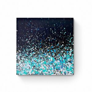 A canvas titled "Star Dust" (60 x 60 cm) featuring an abstract design that transitions from black at the top to white with blue and green splatters at the bottom. Abstract Art by Thanh Lyons